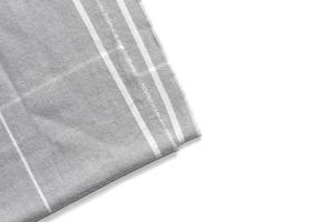 A piece of gray checked fabric isolated on a white background with an area for text photo