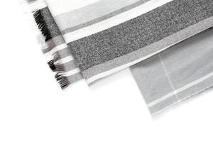 Part of a beautiful gray scarf isolated on a white background with an area for text photo