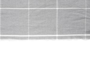 A piece of gray checked fabric isolated on a white background with an area for text photo