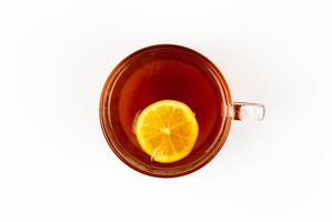 Top view tea in cup with mint and lemon isolated on white background photo