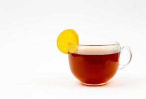 Tea in cup with leaf mint and lemon isolated on white background photo