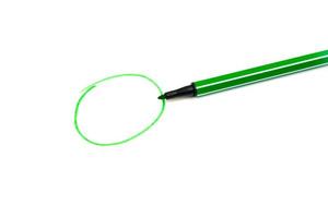 Green circle and a green marker on a white background with an empty space for text photo