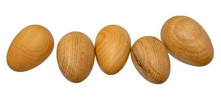 five hand turned wooden eggs in a row photo