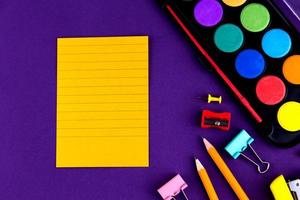 School office supplies stationery on a purple background photo