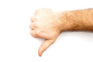 mano peluda masculina mostrando el pulgar hacia abajo foto