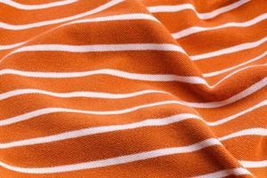Beautiful summer background made of striped twisted fabric photo