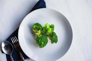 Healthy broccoli in a plate photo