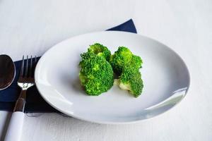 Healthy broccoli in a plate photo