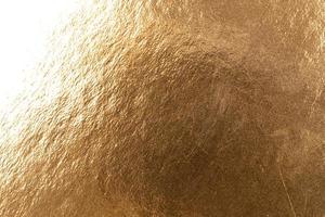 Abstract texture of golden metal macro shot background at close range photo