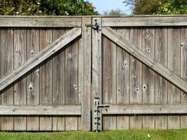Close crop of a wooden garden gate with latches