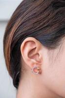 Asian woman with diamond earring photo