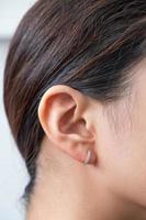 Asian woman with diamond earring photo