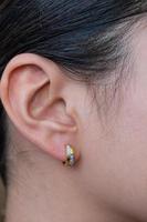 Asian woman with diamond earring photo