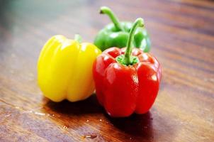 Fresh Bell peppers raw food on wood table backgrounds photo
