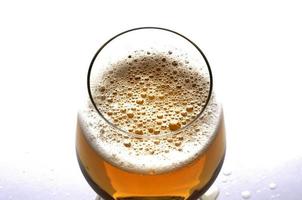 Close up for beer bubbles in glass for beer days concept photo