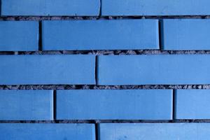 Brick wall background in blue photo