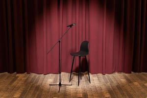 microphone and stool on a stage with curtains behind photo