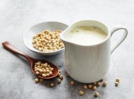 Soy milk and soy on the table photo