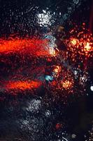 rain on the window at night on the street photo