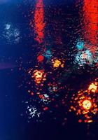 rain on the window at night on the street photo