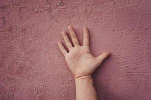 hand gesturing on the wall photo