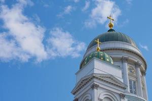 The towers of the cathedral in Helsinki against the blue sky photo