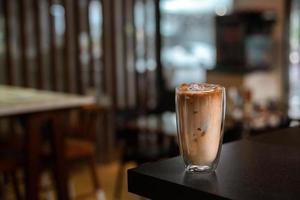 Iced coffee on the table inside the cafe photo