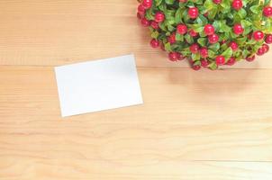 Paper note on wood background photo