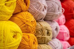 The texture of multi colored fluffy woolen threads for knitting photo