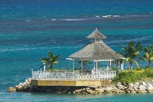 Beautiful Lonely Gazebo Surrounded by the Ocean photo