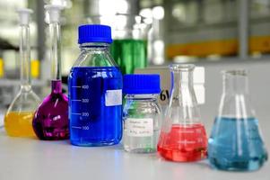 Laboratory glassware containing colorful chemical liquid photo