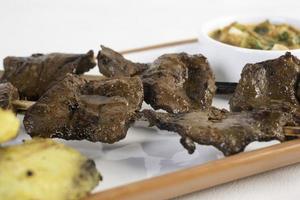 Anticuchos Peruvian cuisine grilled skewered beef heart photo