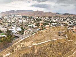 Aerial view down to Gori castle, Georgia photo