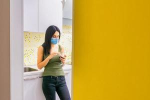 Girl in the kitchen during pandemic isolation photo