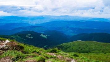 Carpathian Mountains Panorama of green hills in summer mountain photo