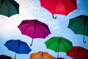 Multi colored umbrellas with blue sky photo