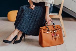 Beautiful bags compliment the style of a beautifully dressed girl photo