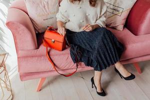 Beautiful bags compliment the style of a beautifully dressed girl photo