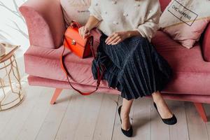 Beautiful bags compliment the style of a beautifully dressed girl photo