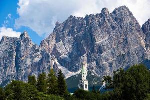 Bell tower and Dolomite peaks photo