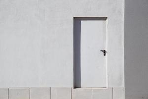 door on the white facade of the building photo