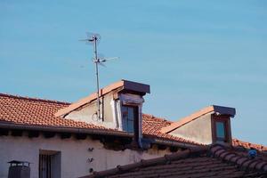 television antena on the rooftop of the house photo