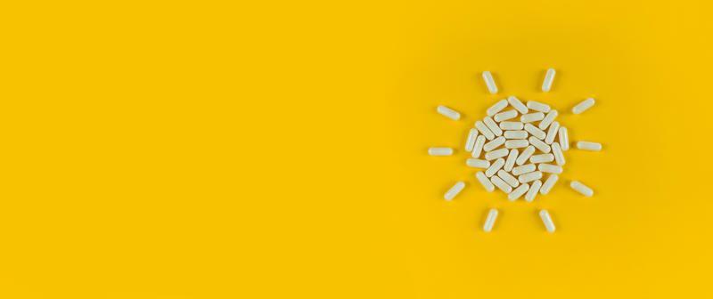 Sun Shape Made From White Pills Capsules On Yellow Backdrop With Copy Space Stock Photo At Vecteezy