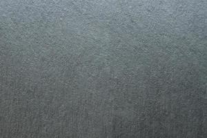 Dark natural granite or other mineral blank background copy space photo
