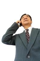 businessman is calling and thinking to something photo