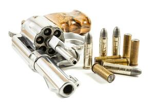 revolver and bullets isolated background photo