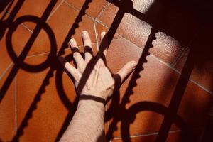 hand gesturing in the shadows photo