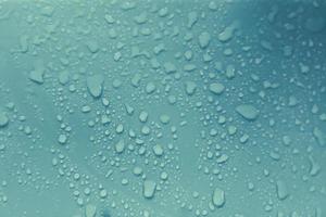 Water droplets on blue background photo