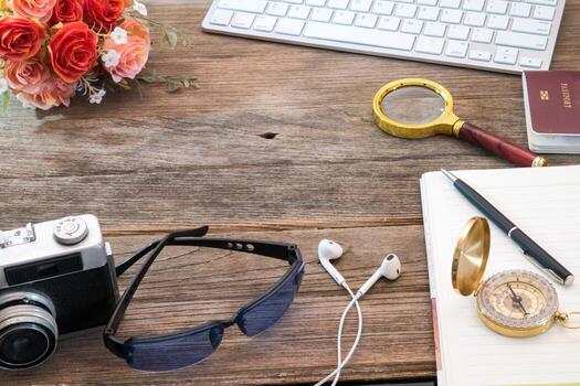 Notebook with magnifier and computer keyboard photo