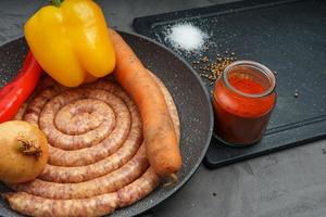 Raw pork saussage with ingredients photo